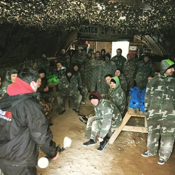 Stag party group in camouflage gear at a paintball base in Carlingford