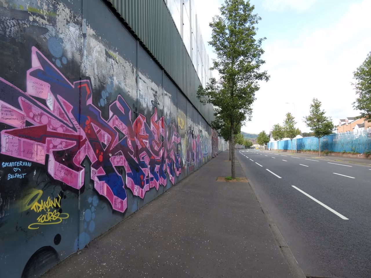Peace Wall on Cupar Way covered in visitor signatures and messages, Belfast