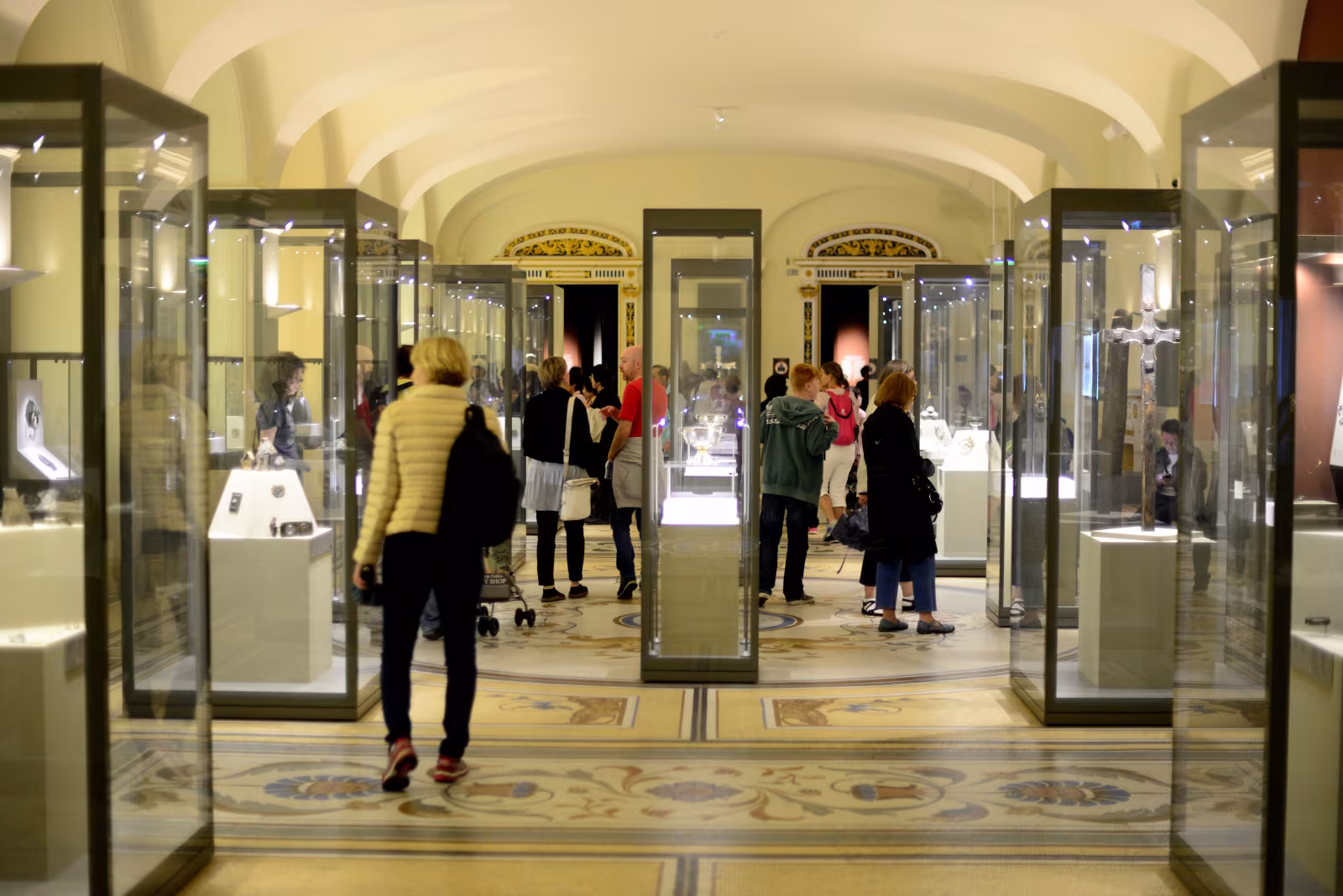 The rotunda main hall of the National Museum of Ireland Archaeology on Kildare Street, with mosaic floor and display cases of ancient gold