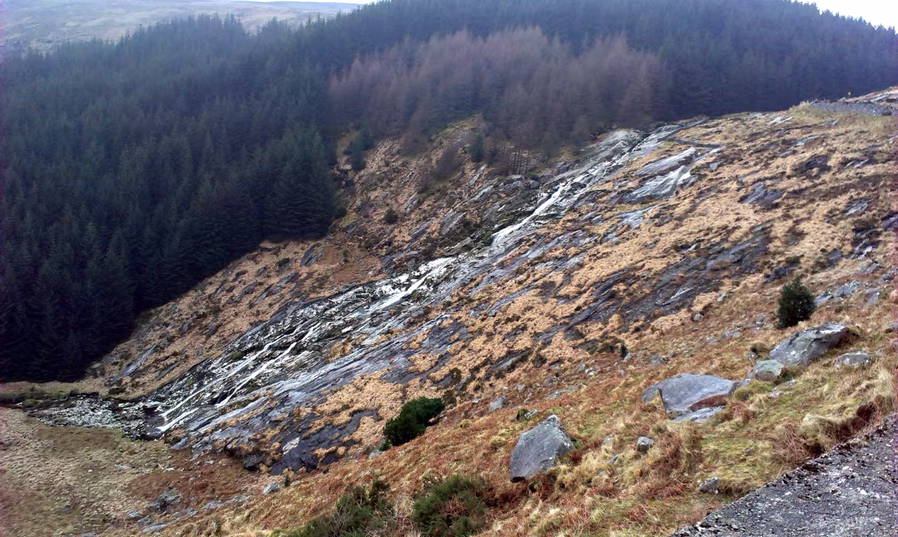 Glenmacnass Waterfall sliding down a long granite slab in the Wicklow Mountains