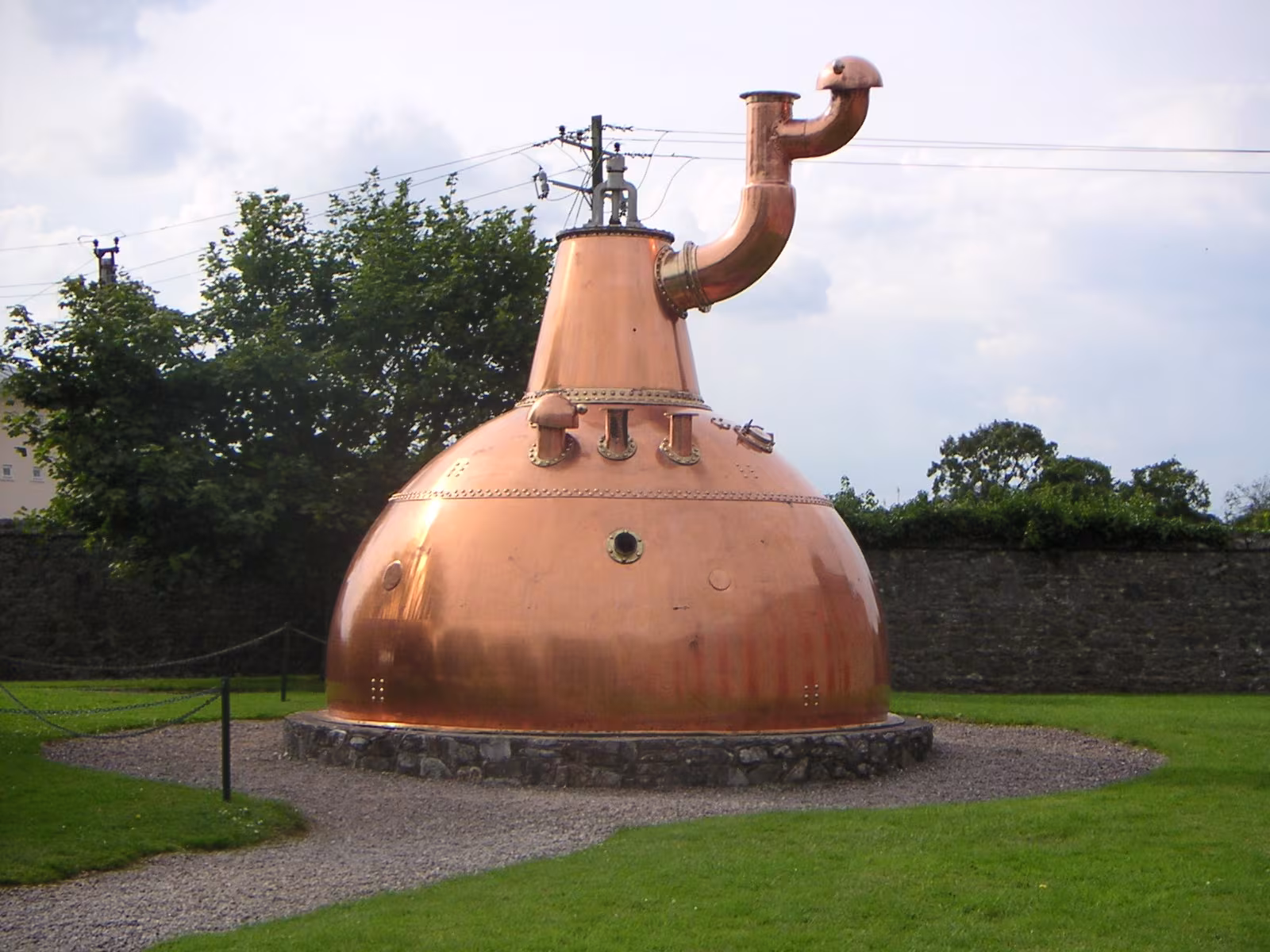 The world's largest copper pot still at the Old Midleton Distillery, a giant copper vessel in the open courtyard