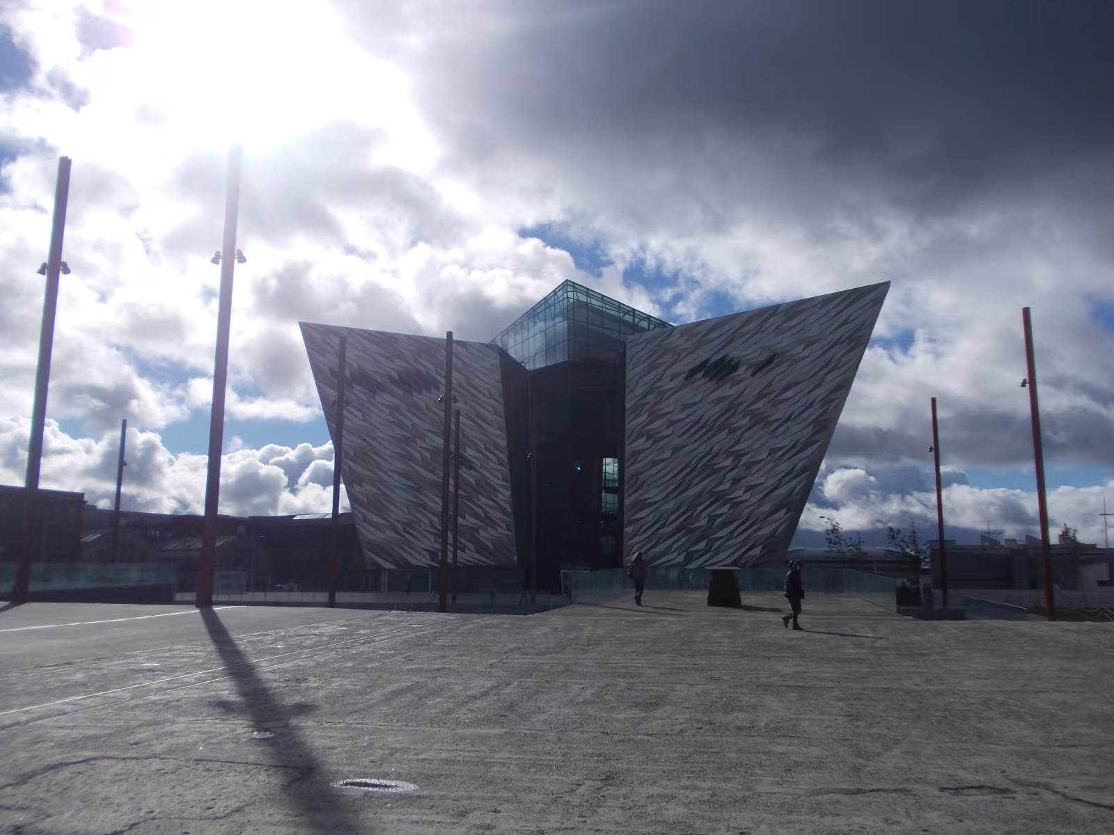 The Titanic Quarter waterfront in Belfast with the museum's angular silver building rising beside the docks